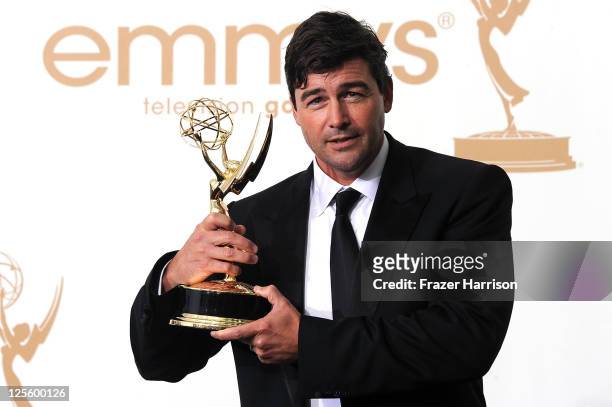 Actor Kyle Chandler of 'Friday Night Lights' poses in the press room after winning Outstanding Lead Actor in a Drama Series during the 63rd Annual...