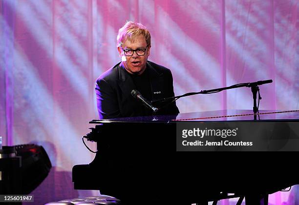 Elton John performs during Tony Bennett's 85th Birthday Gala Benefit for Exploring the Arts at The Metropolitan Opera House on September 18, 2011 in...