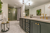 Green tile gives beauty and unique charm to this basement bathroom