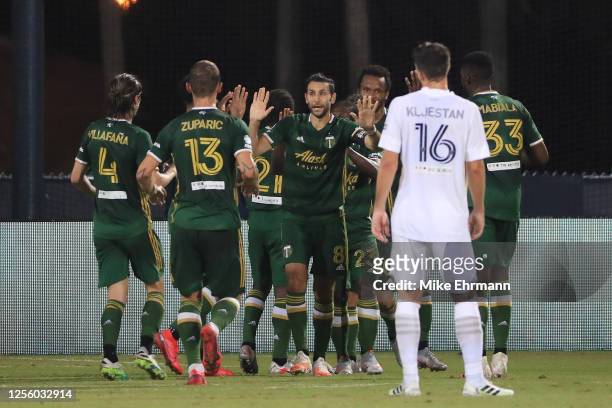 Diego Valeri of Portland Timbers and teammates celebrate the opening goal of the match scored by Jeremy Ebobisse during a match between Los Angeles...