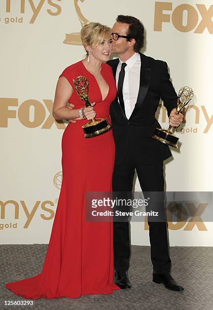 Actors Kate Winslet and Guy Pearce pose in press room during the 63rd Primetime Emmy Awards at the Nokia Theatre L.A. Live on September 18, 2011 in...