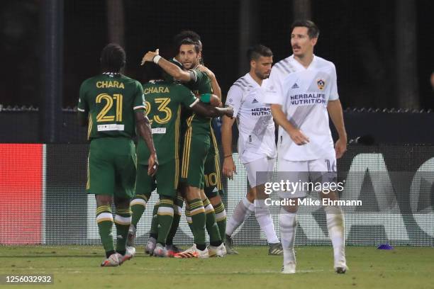 Diego Valeri of Portland Timbers and teammates celebrate the opening goal of the match scored by Jeremy Ebobisse during a match between Los Angeles...