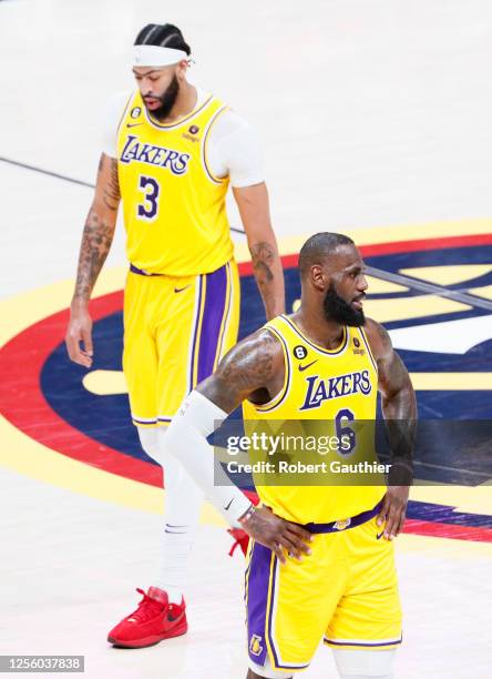 Los Angeles Lakers forward LeBron James, right, and forward Anthony Davis walk on the court during the second half of game two in the NBA Playoffs...