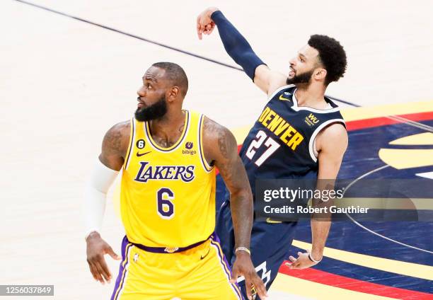 Los Angeles Lakers forward LeBron James, left, watches a three-point shot by Denver Nuggets guard Jamal Murray during the second half of game two in...