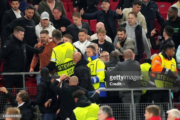 Riots break out between supporters in the stands after the UEFA Conference League semi-final match between AZ Alkmaar and West Ham United FC at the...