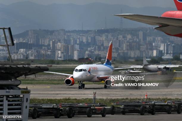 Picture taken on May 19, 2023 shows the passenger plane of Azimuth Airline, conducting the first direct flight from Moscow, arriving in Tbilisi. Last...