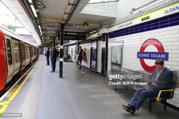 Passengers at Sloane Square London underground station.