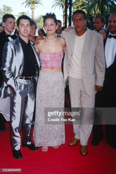 Frederic Diefenthal, Marion Cotillard and Samy Naceri for "Taxi" attend the 53rd Cannes Film Festival in May 2000, in Cannes, France.