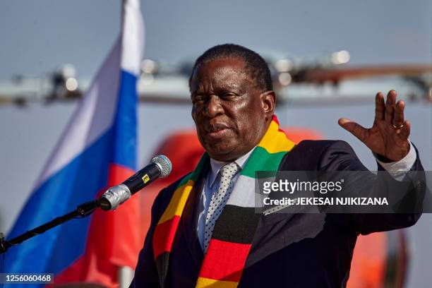 Zimbabwe President Emmerson Mnangagwa speaks during a handover ceremony where he received medical emergency and police helicopters from Sergey...
