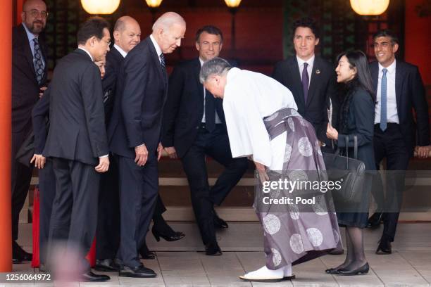 President Joe Biden arrives to meet with the other G7 leaders to take part in the family photo at the Itsukushima Shrine during the G7 Summit on May...