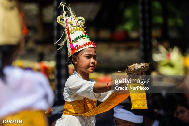 Balinese Hindu women perform dance ahead of Saraswati Day at Tirta Empul Temple in Tampaksiring, Gianyar Regency, Bali, Indonesia, on May 19, 2023....