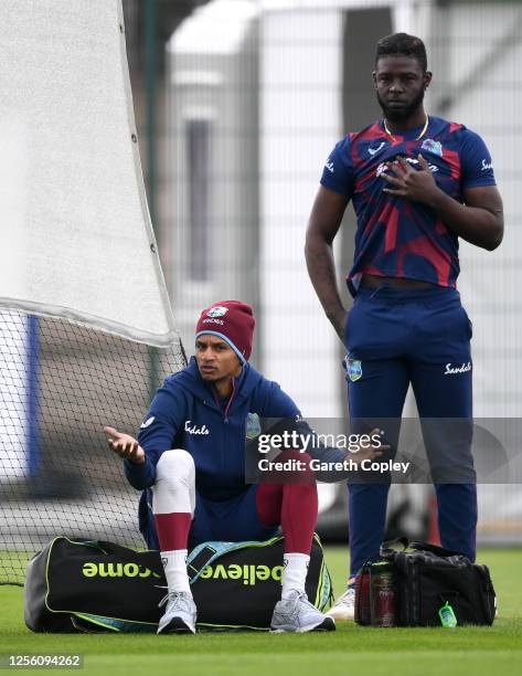 Shane Dowrich speaks to Sheyne Moseley of West Indies during a West Indies Nets Session at Emirates Old Trafford on July 14, 2020 in Manchester,...