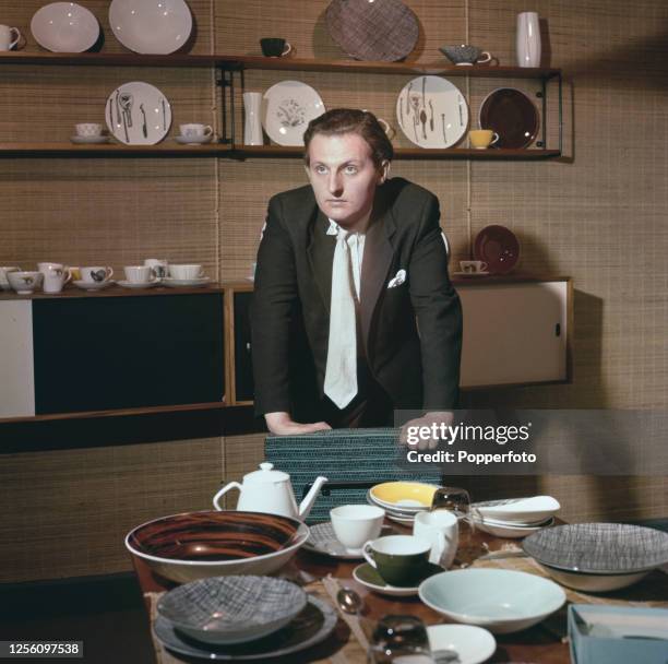 British aristocrat and ceramic designer David Douglas, 12th Marquess of Queensbury, posed with tableware, plates and cups in his own Stoke pottery...