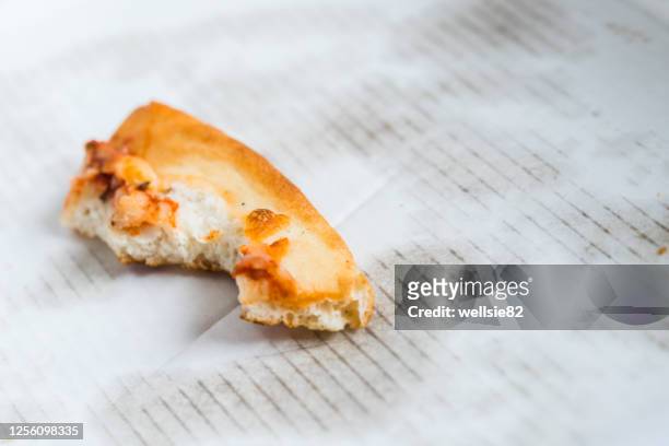 pizza crust left in a box - pizza crust stock pictures, royalty-free photos & images