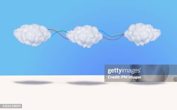 3 clouds connected by wires - cotton cloud stock pictures, royalty-free photos & images