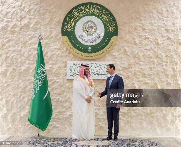 Saudi Arabian Crown Prince Mohammed bin Salman greets the head of Syrian regime Bashar Al Assad , ahead of the 32nd Arab League Summit in Jeddah,...