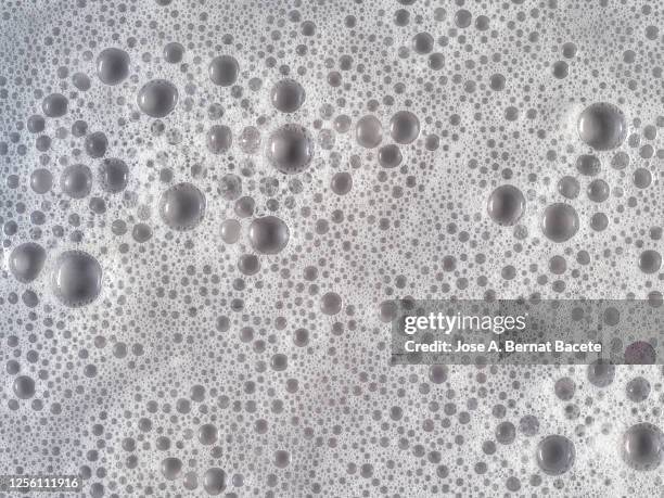 full frame of the textures formed by the soap bubbles. - soap sud stock pictures, royalty-free photos & images