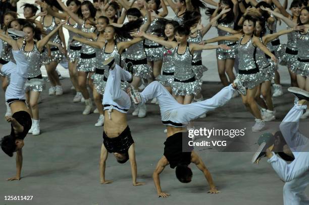 Dancers perform on the stage during the closing ceremony of the 9th National Traditional Games of Ethnic Minorities of the People's Republic of China...