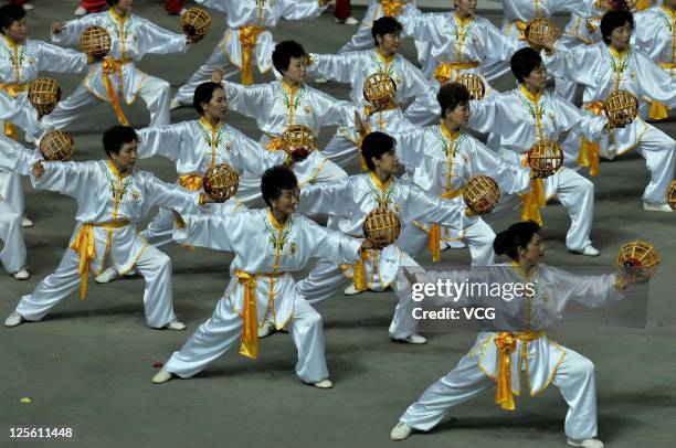 Dancers perform on the stage during the closing ceremony of the 9th National Traditional Games of Ethnic Minorities of the People's Republic of China...