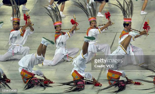 Dancers perform on the stage during the closing ceremony of the 9th National Traditional Games of Ethnic Minorities of the People's Republic of China...