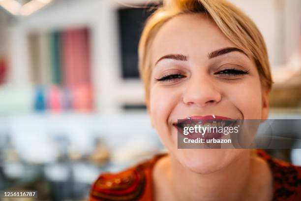smiling woman with sugar sprinkles on lips - candy lips stock pictures, royalty-free photos & images