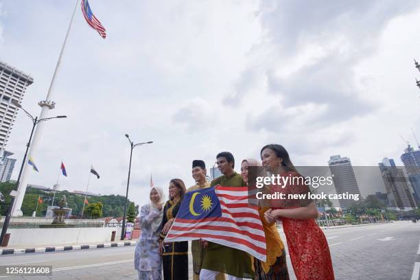 malaysian ethnic with traditional clothing at merdeka square kuala lumpur - malaysia kuala lumpur merdeka square stock pictures, royalty-free photos & images