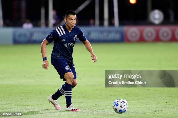 Roger Espinoza of Sporting Kansas City controls the ball during a match against Minnesota United in the MLS Is Back Tournament at ESPN Wide World of...