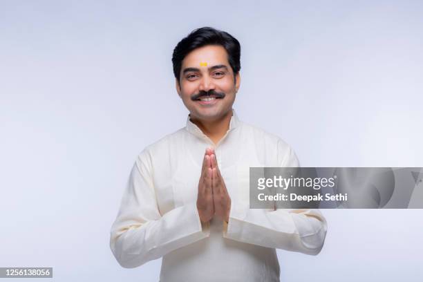 handsome man - stock photo - namaste greeting stock pictures, royalty-free photos & images