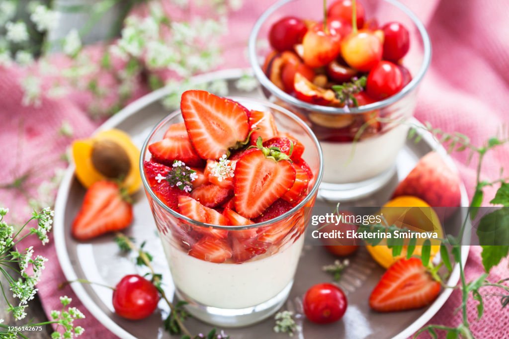 Delicious Italian dessert Panna Cotta with fresh summer strawberries