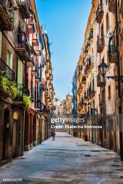 typical narrow street among colorful houses in tarragona, spain - tarragona stock-fotos und bilder