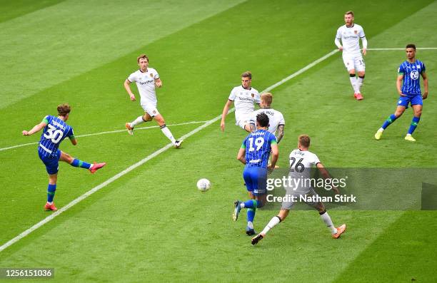 Kieran Dowell of Wigan Athletic scores his team's third goal during the Sky Bet Championship match between Wigan Athletic and Hull City at DW Stadium...