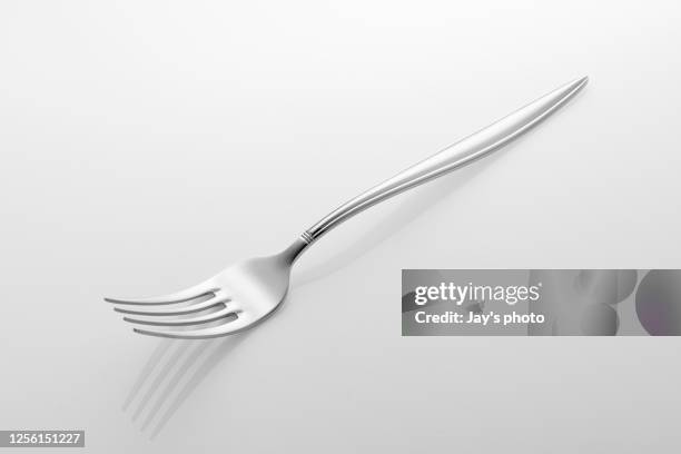 silver fork isolated on white background. - forchetta foto e immagini stock