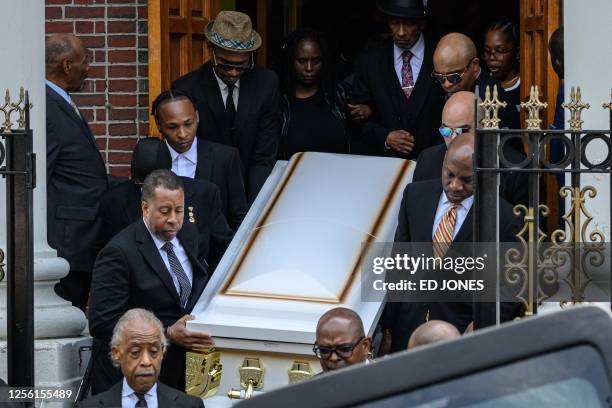 Mourners carry for the casket of Jordan Neely, at Mount Neboh Baptist Church after a funeral service in the Harlem neighborhood of New York City on...