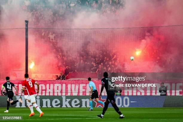 Supporters of Alkmaar burn flares during the UEFA Europa Conference League semi-final second leg football match between AZ Alkmaar and West Ham...