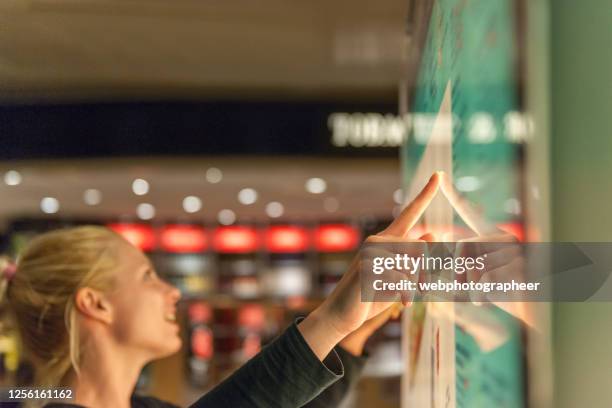 using touch screen to find informations - interactivity stock pictures, royalty-free photos & images