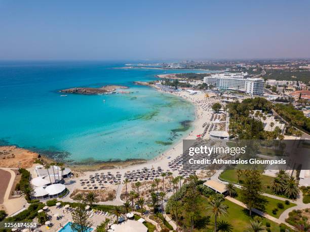 Aerial view of Nissi beach on July 12, 2020 in Ayia Napa, Cyprus. Nissi beach is a sandy beach with clean turquoise waters and the beach awarded with...