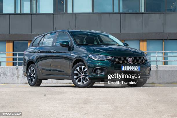 fiat tipo sw on a street - fiat stock pictures, royalty-free photos & images