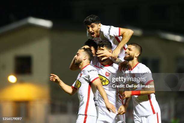 Soroush Rafiei of Persepolis celebrates after scoring his team's third goal with team mates Giorgi Gvelesiani of Persepolis, Morteza Pouraliganji of...