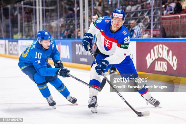 Richard Panik of Slovakia chased byNikita Mikhailis of Kazakhstan during the 2023 IIHF Ice Hockey World Championship Finland - Latvia game between...