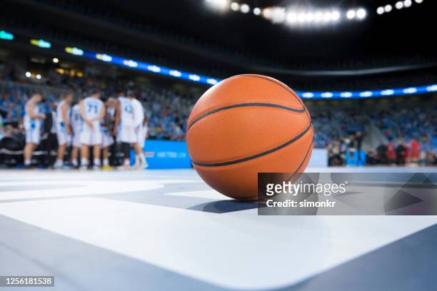 basketball on court - basketball court floor stock pictures, royalty-free photos & images