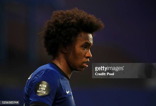 Black Lives Matter movement logo is seen on the shirt sleeve of Willian of Chelsea during the Premier League match between Chelsea FC and Norwich...