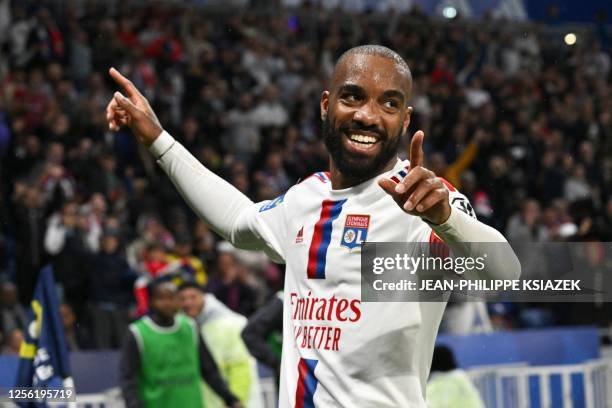 Lyon's French forward Alexandre Lacazette celebrates scoring his team's first goal during the French L1 football match between Olympique Lyonnais and...