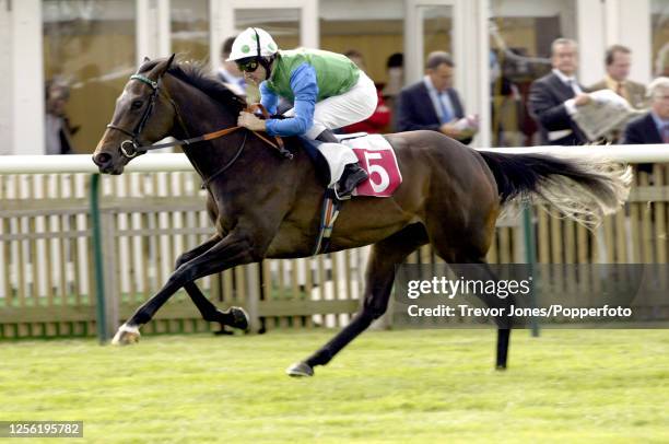 Irish Jockey Jimmy Fortune riding Echoes In Eternity winning the EBF Maiden Fillies Stakes at Newmarket Rowley Mile Course, 24th September 2002.