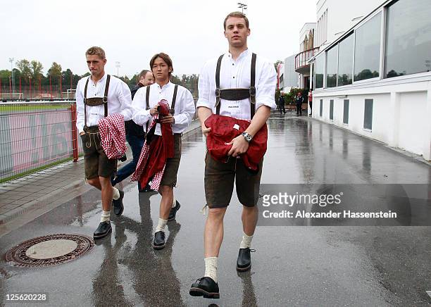 Manuel Neuer of FC Bayern Muenchen arrives with his team mates Takashi Usami and Nils Petersen for the Paulaner photocall at Bayern Muenchen`s...