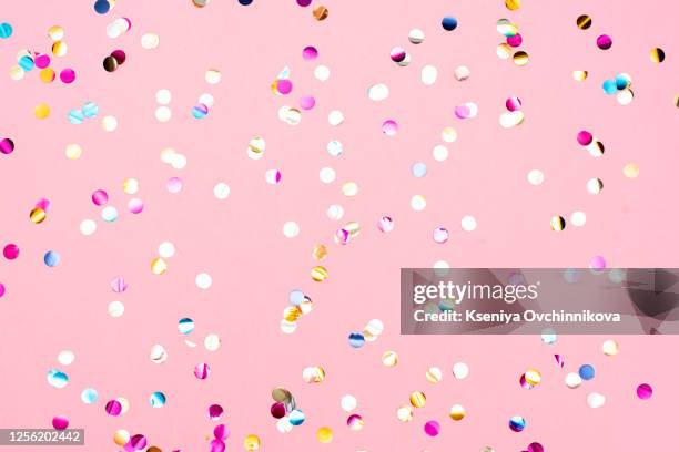 pink pastel festive background with confetti and sparkles. flat lay style. - pink confetti stock pictures, royalty-free photos & images