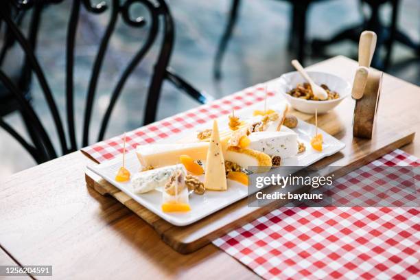 cheese platter on wooden background - roquefort cheese stock pictures, royalty-free photos & images