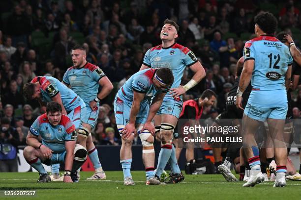 Glasgow's players react during the European Challenge Cup rugby union final match between Glasgow Warriors and Rugby Club Toulonnais at the Aviva...