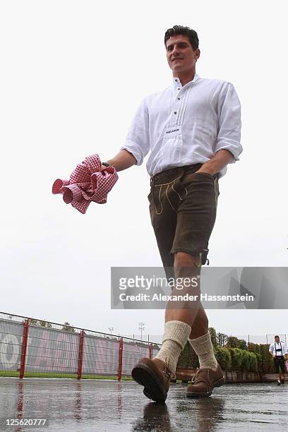 Mario Gomez of FC Bayern Muenchen arrives for the Paulaner photocall at Bayern Muenchen's trainings ground Saebener Strasse on September 19, 2011 in...