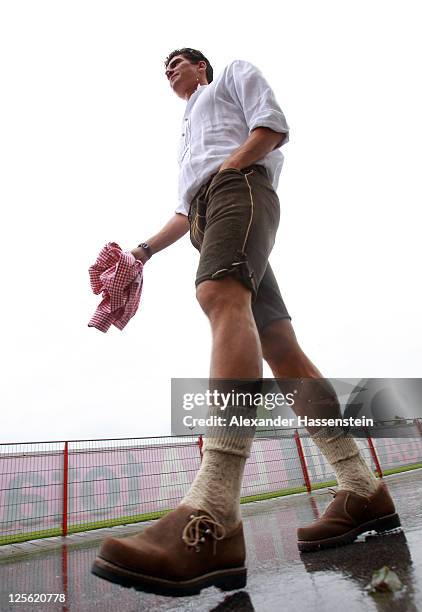 Mario Gomez of FC Bayern Muenchen arrives for the Paulaner photocall at Bayern Muenchen's trainings ground Saebener Strasse on September 19, 2011 in...