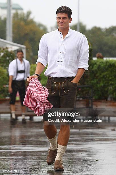 Mario Gomez of FC Bayern Muenchen arrives for the Paulaner photocall at Bayern Muenchen's trainings ground Saebener Strasse on September 19, 2011 in...